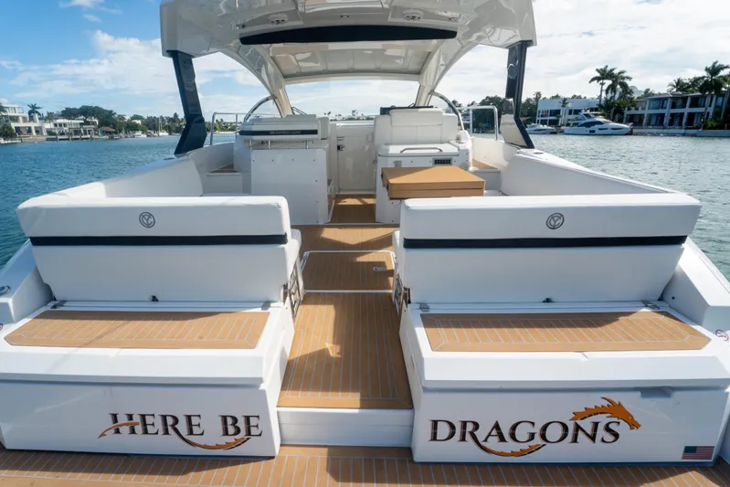  Yacht Photos Pics 2018 Cruisers Yachts 390 Express Coupe on water, featuring spacious deck seating.