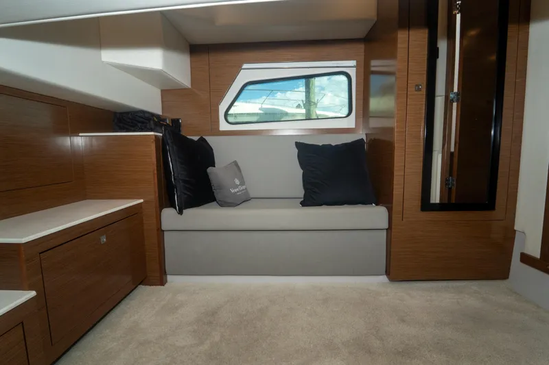  Yacht Photos Pics 2018 Cruisers Yachts 390 Express Coupe interior with modern seating and wooden cabinetry.