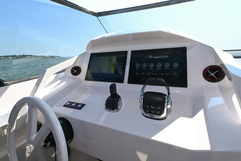 Take It Easy V Yacht Photos Pics Helm of 2022 Vanquish VQ58 yacht with modern controls and navigation screens.
