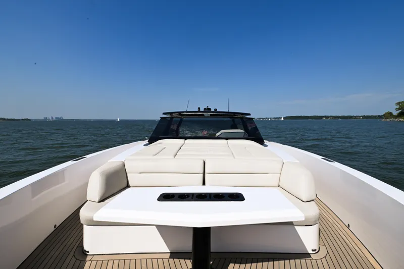 Take It Easy V Yacht Photos Pics Luxury 2022 Vanquish VQ58 yacht with spacious deck and seating on open water.