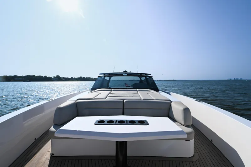 Take It Easy V Yacht Photos Pics 2022 Vanquish VQ58 luxury yacht on open water, featuring sleek design and spacious deck.