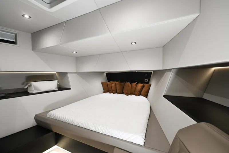 Take It Easy V Yacht Photos Pics Luxurious interior of 2022 Vanquish VQ58 yacht with modern bed and ambient lighting.