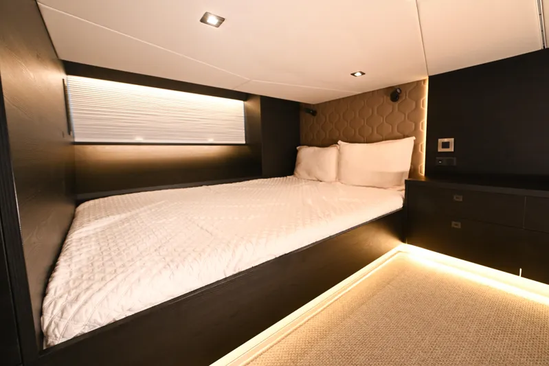 Take It Easy V Yacht Photos Pics Luxurious 2022 Vanquish VQ58 yacht bedroom with modern lighting and elegant design.