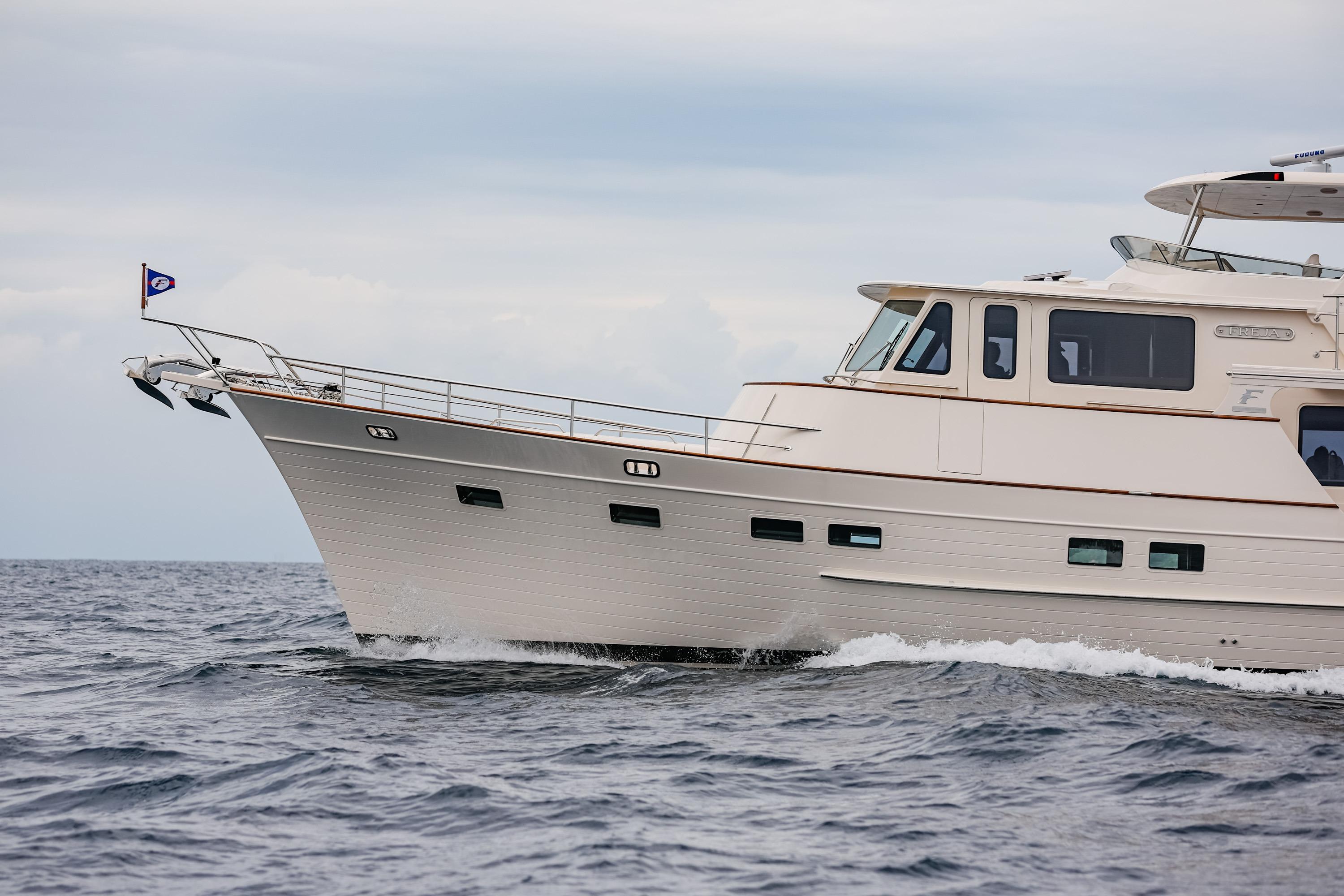 Fleming 85 Pilothouse yacht cruising on open water, 2027 model.