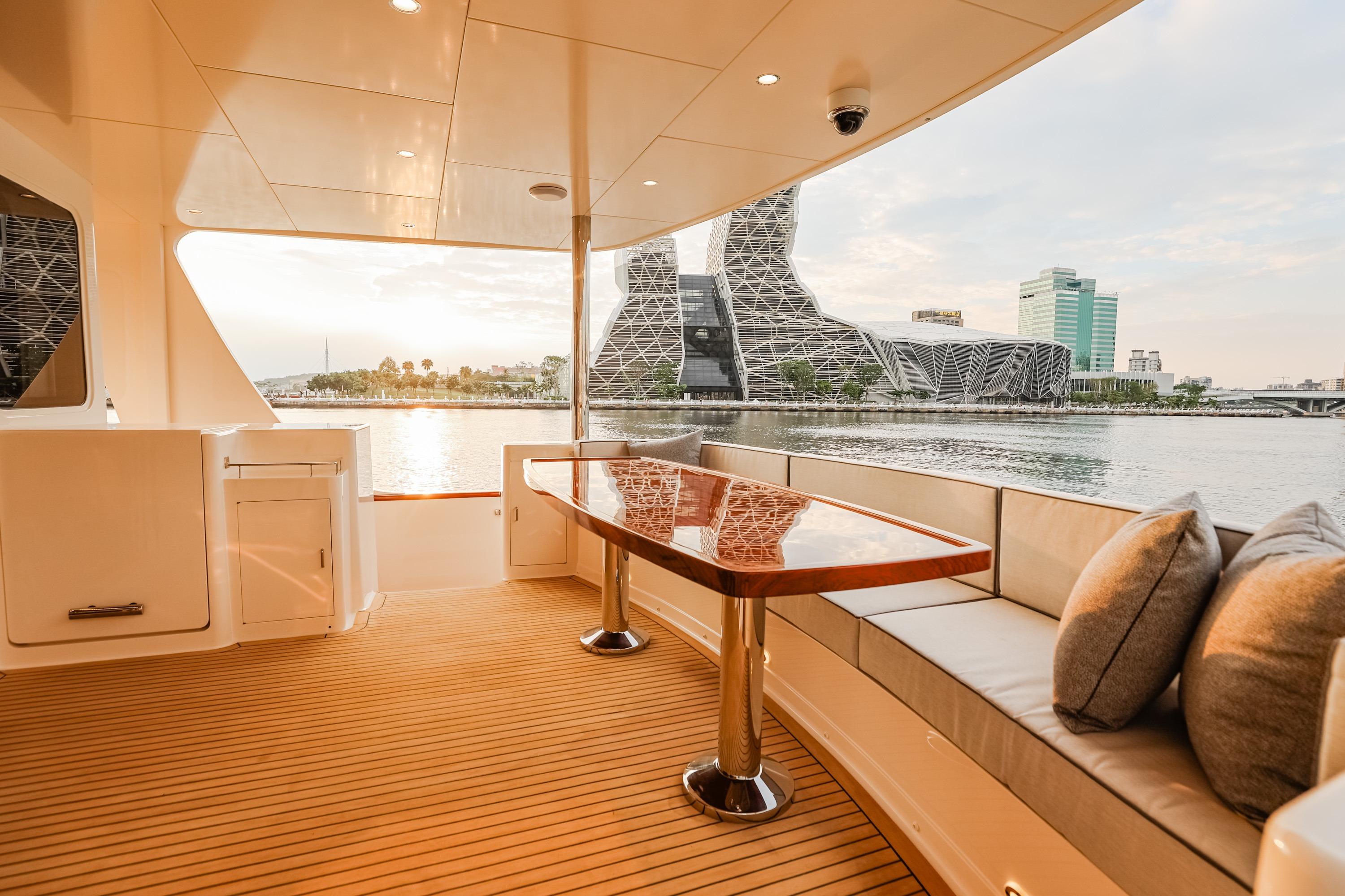 Luxurious 2027 Fleming 85 Pilothouse yacht deck with elegant seating and waterfront view.