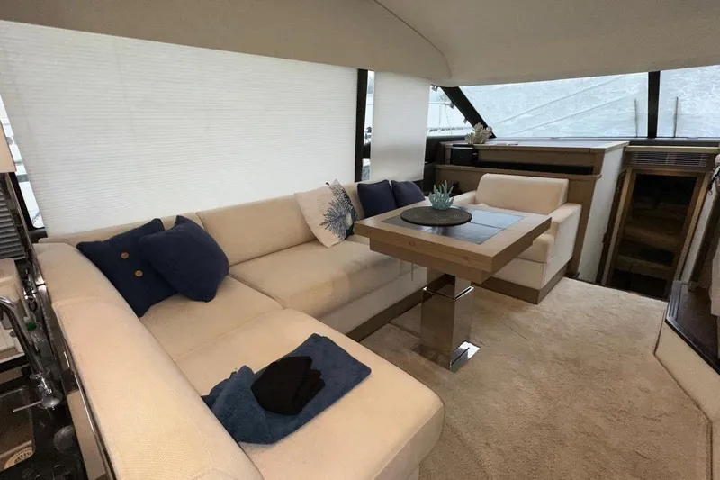  Yacht Photos Pics Luxurious interior of a 2018 Prestige 520 yacht with elegant seating and modern decor.