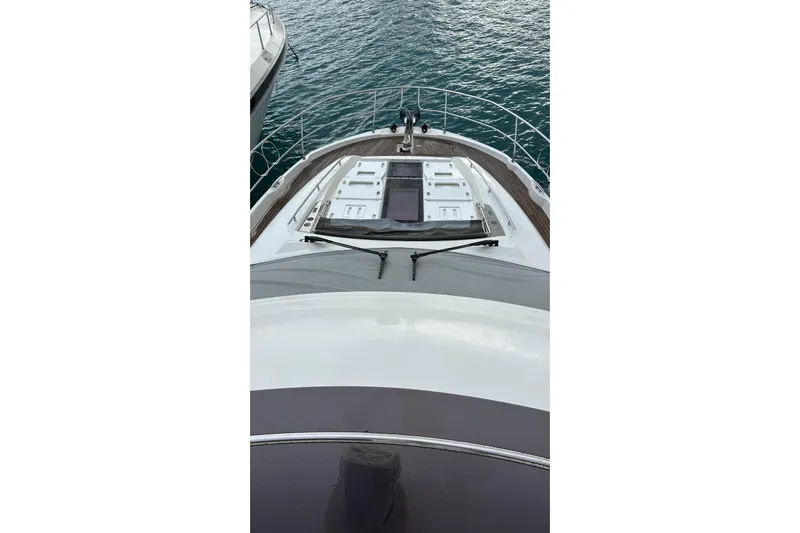  Yacht Photos Pics Bow view of 2018 Prestige 520 yacht on water, showcasing deck and railing.