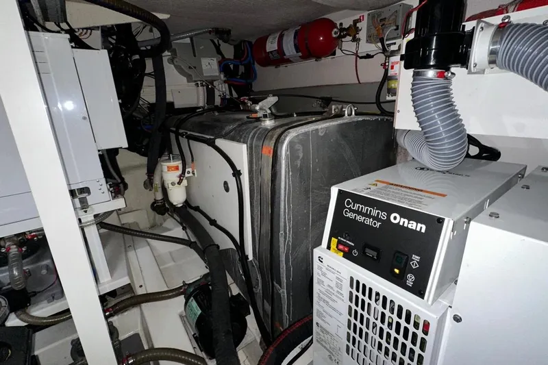  Yacht Photos Pics Engine room of 2018 Prestige 520 yacht with Cummins Onan generator and fire extinguisher.