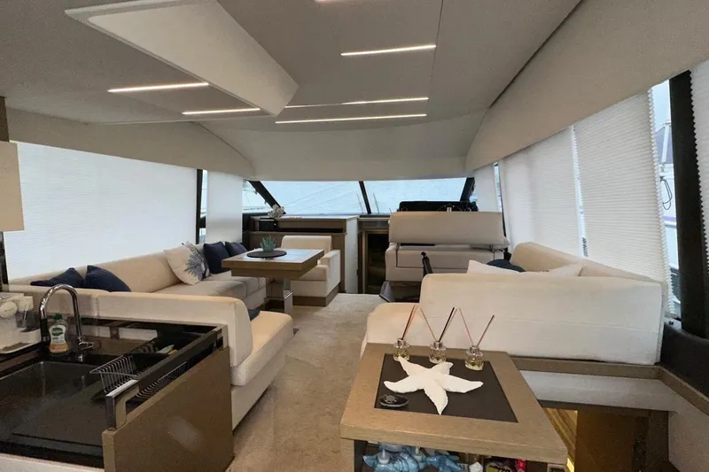  Yacht Photos Pics Luxurious interior of a 2018 Prestige 520 yacht with modern furnishings and elegant design.
