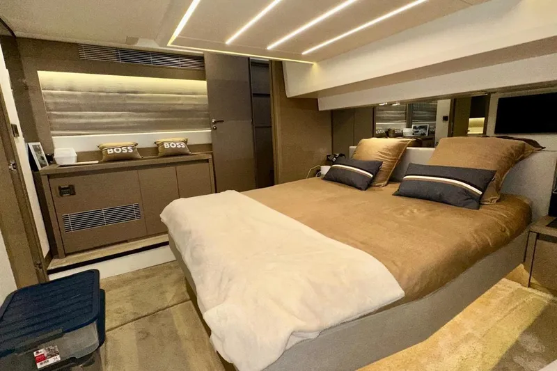 Yacht Photos Pics Luxurious interior of a 2018 Prestige 520 yacht bedroom with elegant bedding.