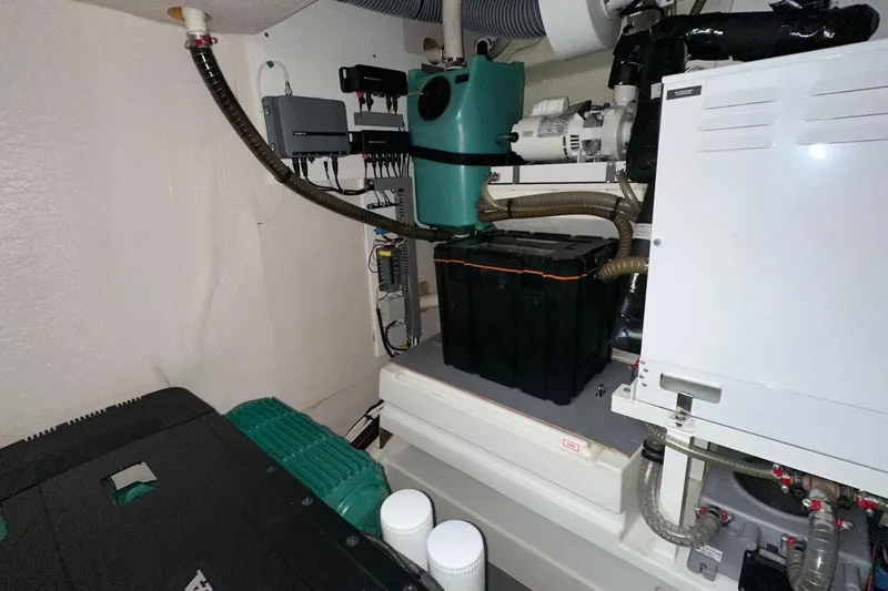  Yacht Photos Pics Engine room of a 2018 Prestige 520 yacht, showcasing mechanical components and systems.