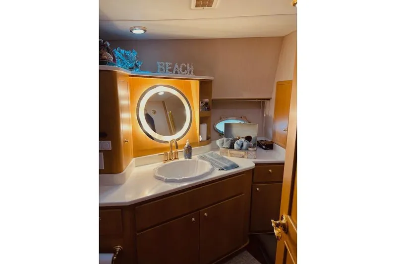 "robyn Faye" Yacht Photos Pics Luxurious bathroom in 1996 Forbes Cooper pilot house yacht with elegant vanity and lighting.