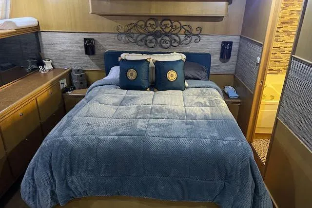 "robyn Faye" Yacht Photos Pics Cozy bedroom in 1996 Forbes Cooper pilot house yacht with elegant decor and plush bedding.