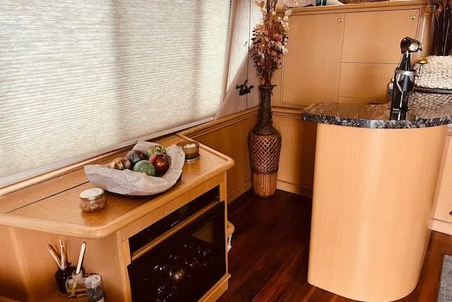 "robyn Faye" Yacht Photos Pics Interior of 1996 Forbes Cooper pilot house with elegant wood finish and modern decor.