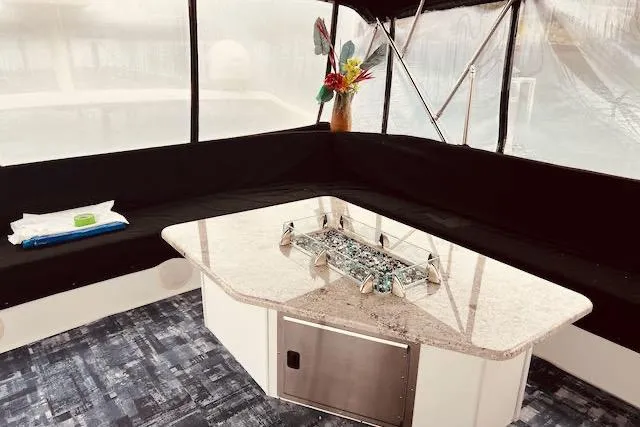 "robyn Faye" Yacht Photos Pics Luxurious 1996 Forbes Cooper pilot house interior with elegant seating and modern table design.