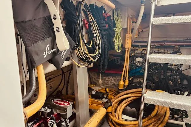 "robyn Faye" Yacht Photos Pics Storage area in a 1996 Forbes Cooper pilot house with ropes and equipment.