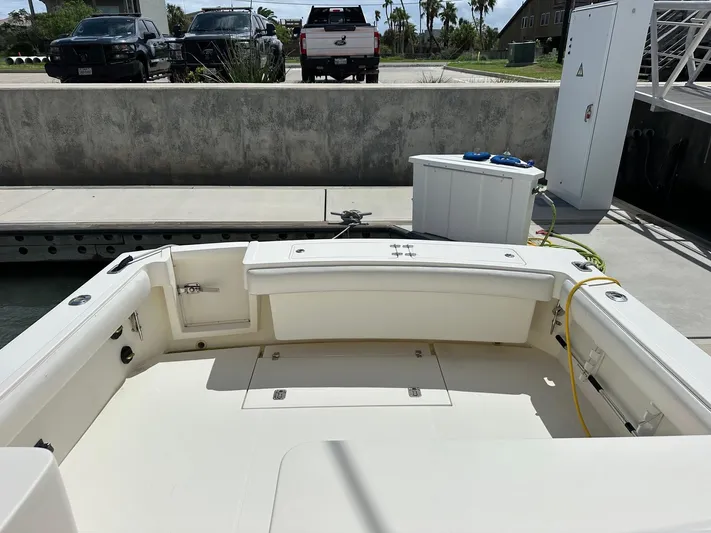  Yacht Photos Pics 2006 Albemarle 320 Express Fisherman boat docked, showing spacious deck and storage compartments.