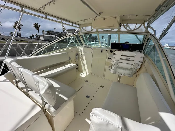  Yacht Photos Pics 2006 Albemarle 320 Express Fisherman boat interior with seating and helm station.