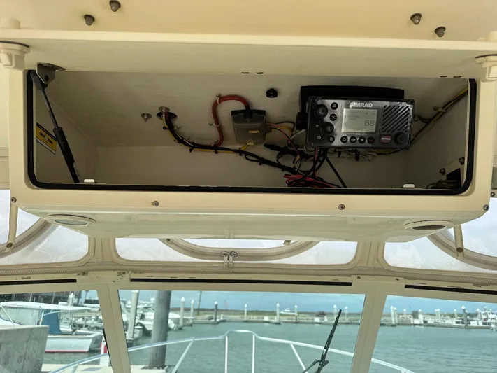  Yacht Photos Pics 2006 Albemarle 320 Express Fisherman electronics compartment with marine radio.