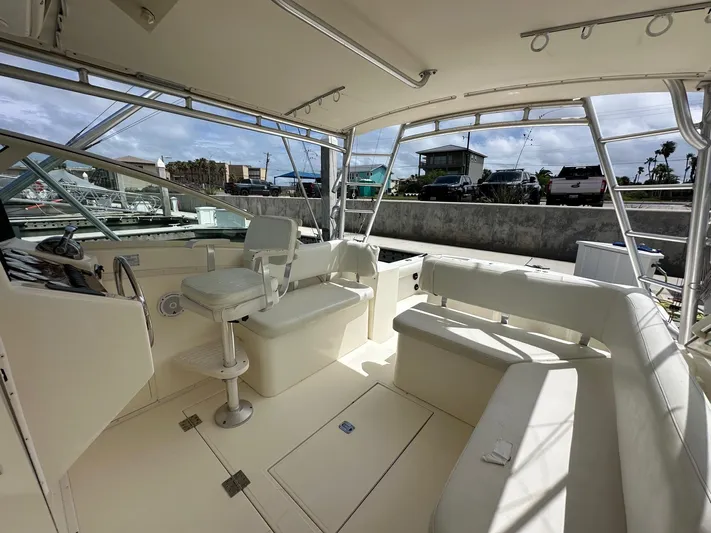  Yacht Photos Pics 2006 Albemarle 320 Express Fisherman boat interior with seating and helm station.