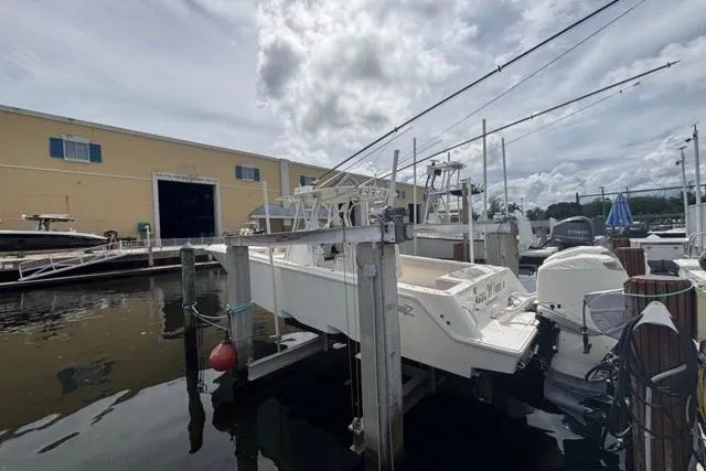  Yacht Photos Pics 2016 SeaVee 34 boat docked at marina with fishing rods and equipment.