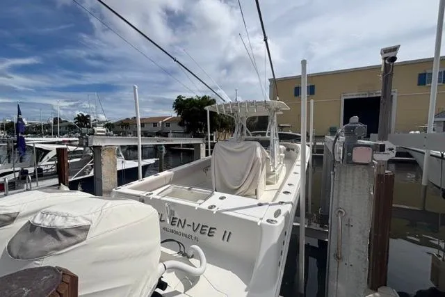  Yacht Photos Pics 2016 SeaVee 34 boat docked at marina under cloudy sky.