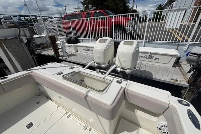  Yacht Photos Pics 2016 SeaVee 34 boat with dual outboard engines docked at marina.