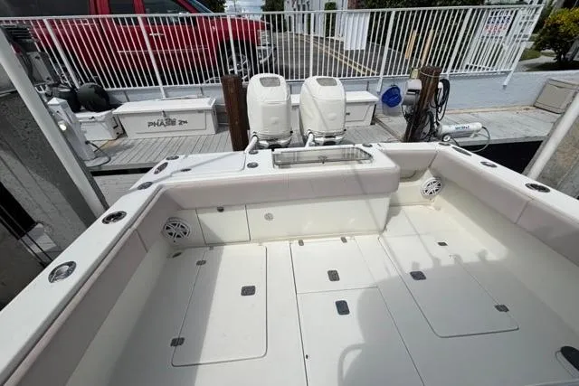  Yacht Photos Pics 2016 SeaVee 34 boat deck with twin outboard engines, spacious layout, and storage compartments.