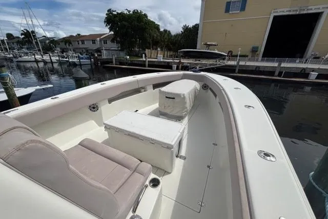  Yacht Photos Pics 2016 SeaVee 34 boat docked, featuring spacious seating and storage, in a marina setting.