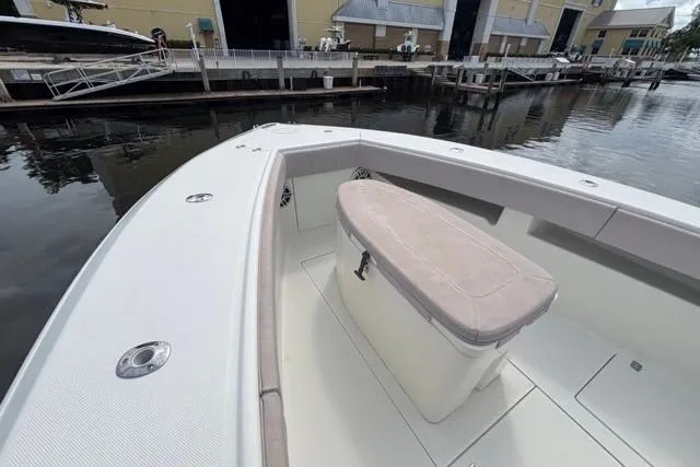  Yacht Photos Pics 2016 SeaVee 34 boat with cushioned seating, docked at a marina.