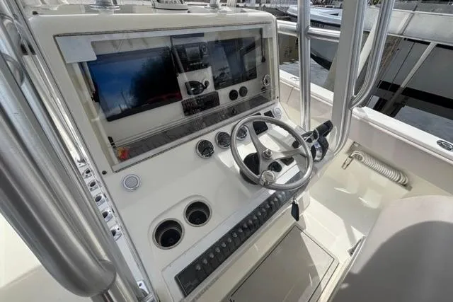  Yacht Photos Pics 2016 SeaVee 34 boat helm with steering wheel, dual screens, and control panel.