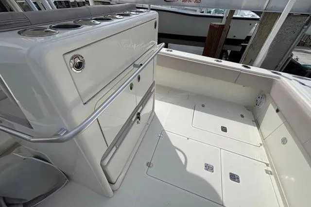  Yacht Photos Pics 2016 SeaVee 34 boat deck with storage compartments and rod holders.