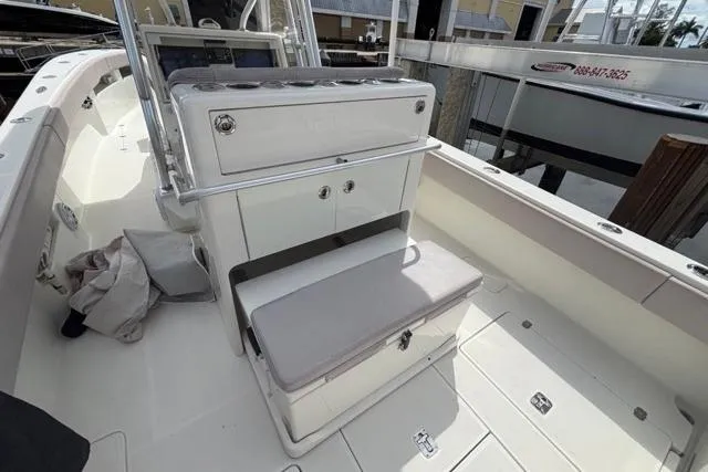  Yacht Photos Pics 2016 SeaVee 34 boat interior with seating and storage, docked at marina.