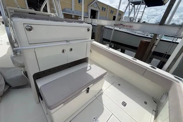  Yacht Photos Pics 2016 SeaVee 34 boat interior with seating and storage, docked at marina.