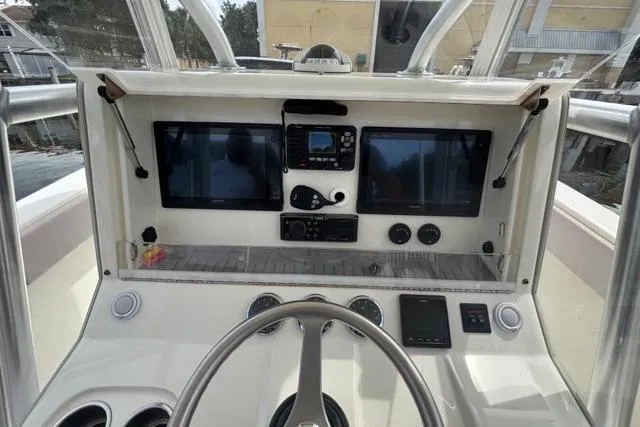  Yacht Photos Pics 2016 SeaVee 34 boat dashboard with dual screens and navigation controls.