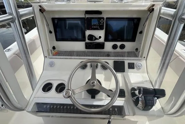  Yacht Photos Pics 2016 SeaVee 34 boat dashboard with dual screens and steering wheel.