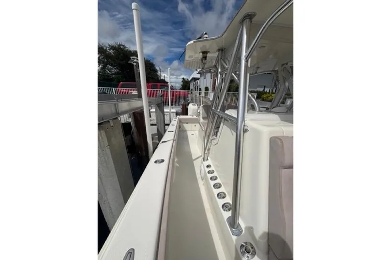  Yacht Photos Pics 2016 SeaVee 34 boat deck with stainless steel railings and rod holders.