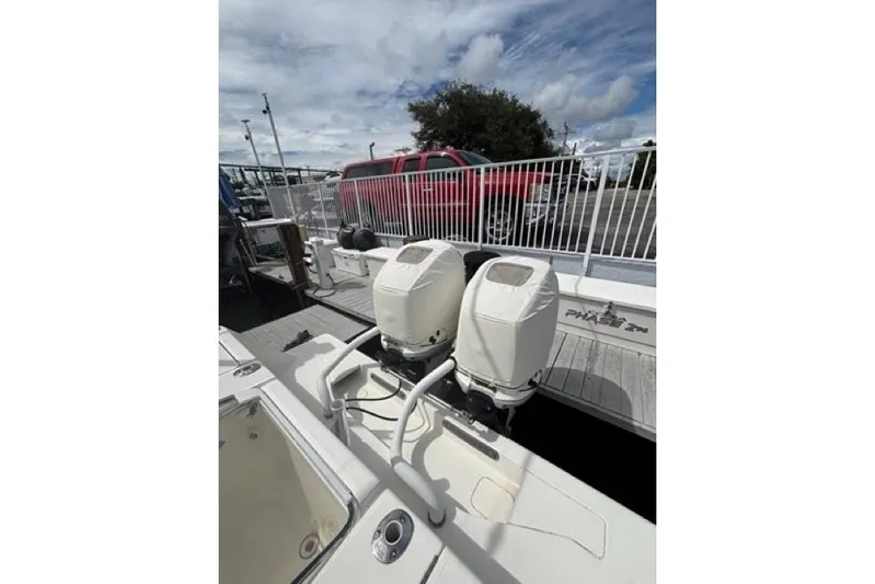  Yacht Photos Pics 2016 SeaVee 34 boat with dual outboard engines at a dock.