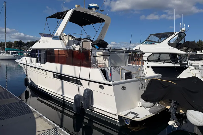  Yacht Photos Pics 1988 Ocean Alexander 42' yacht docked at marina under clear blue sky.