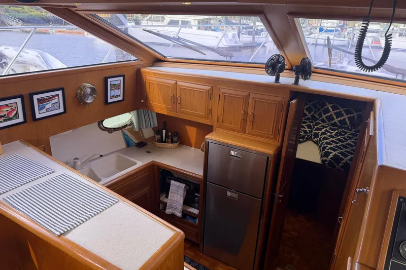  Yacht Photos Pics Interior of 1988 Ocean Alexander 42' yacht with kitchen and cozy cabin.
