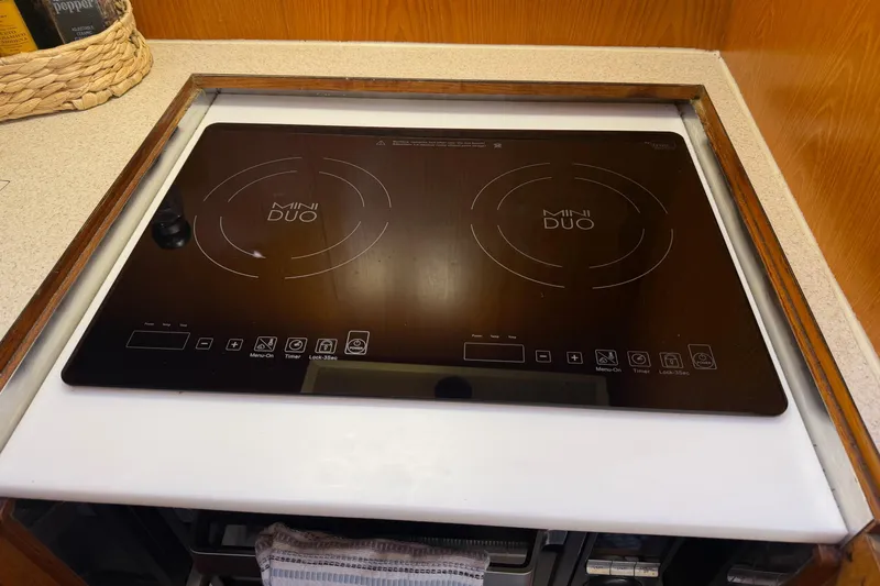  Yacht Photos Pics Induction cooktop on 1988 Ocean Alexander 42' yacht kitchen counter.