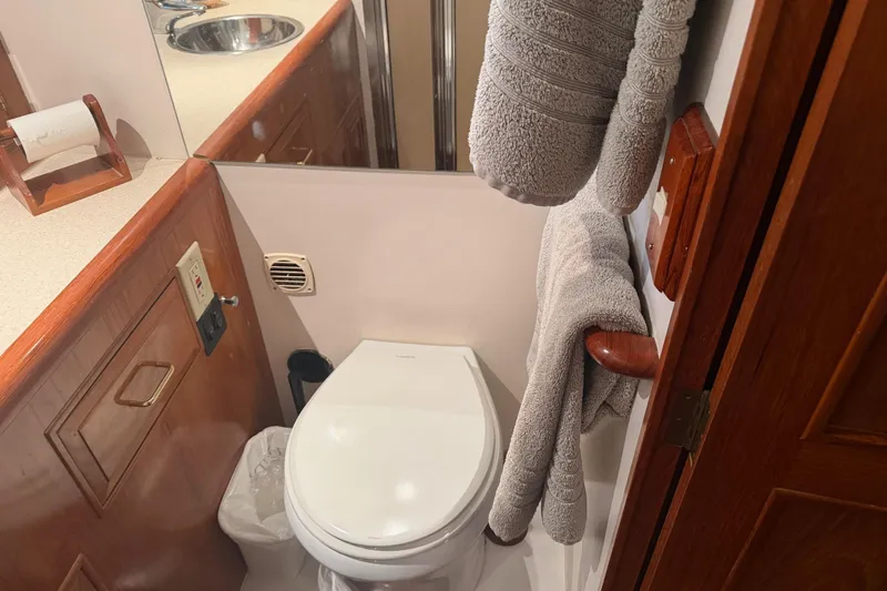  Yacht Photos Pics Bathroom interior of 1988 Ocean Alexander 42' yacht with toilet and towels.