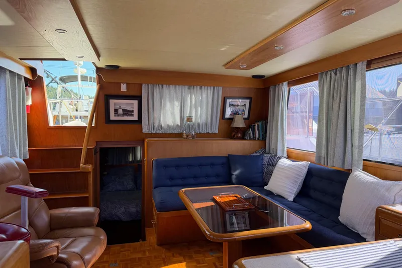  Yacht Photos Pics Interior of 1988 Ocean Alexander 42' yacht with cozy seating and elegant decor.