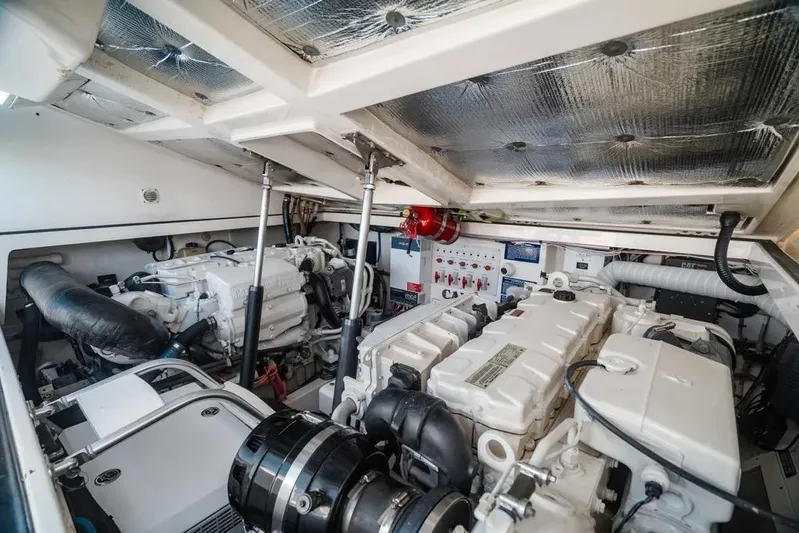 Gyro Stabilized Yacht Photos Pics Engine room of 2005 Cabo 35 Express boat, showcasing dual engines and control systems.