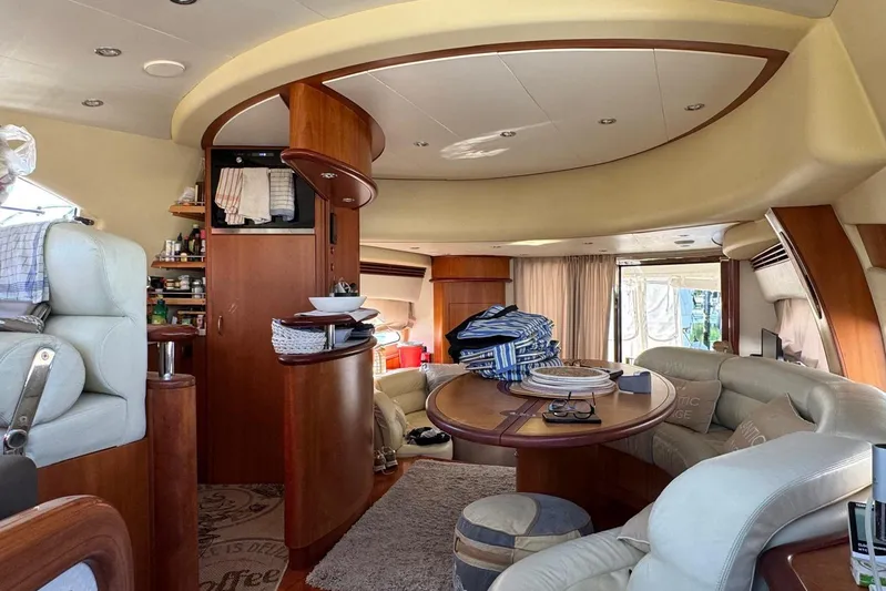  Yacht Photos Pics Luxurious interior of a 2006 Aicon 56 yacht with elegant seating and dining area.