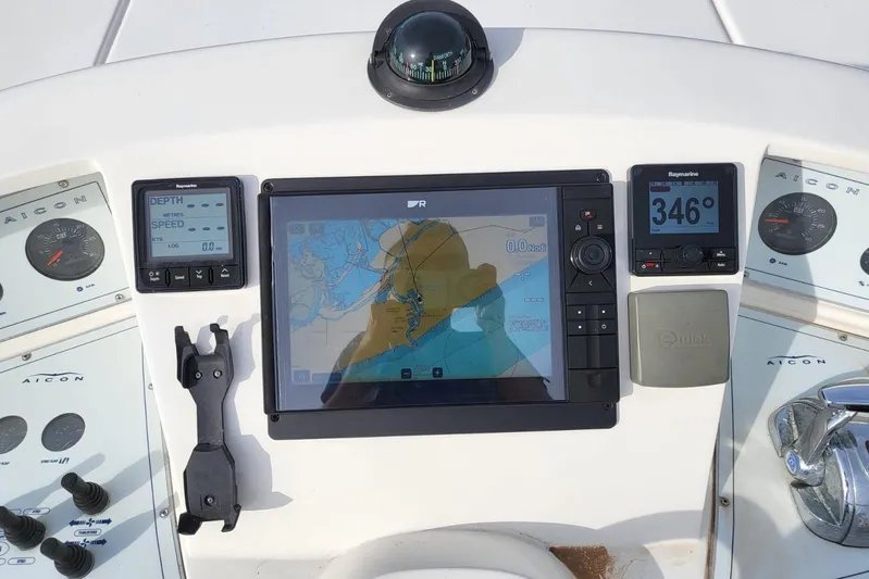  Yacht Photos Pics Control panel of a 2006 Aicon 56 yacht with navigation instruments.