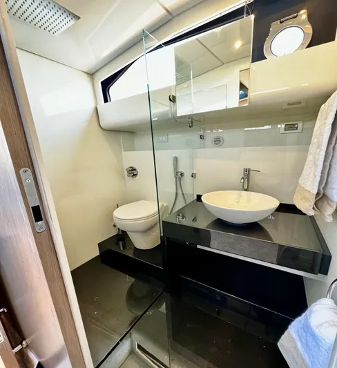  Yacht Photos Pics Luxurious bathroom in 2025 Anvera 58 yacht with modern fixtures and sleek design.