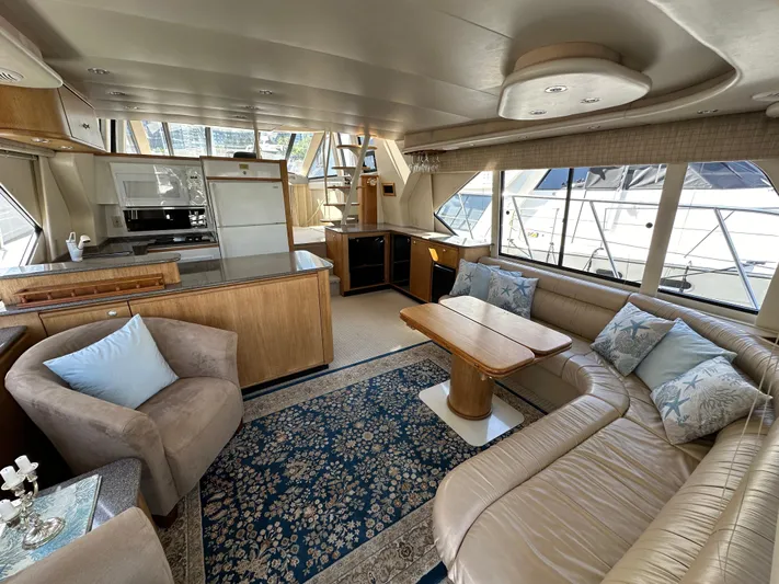 Solana Yacht Photos Pics Luxurious interior of 2000 Bayliner 5288 Pilot House Motoryacht with spacious seating and elegant decor.