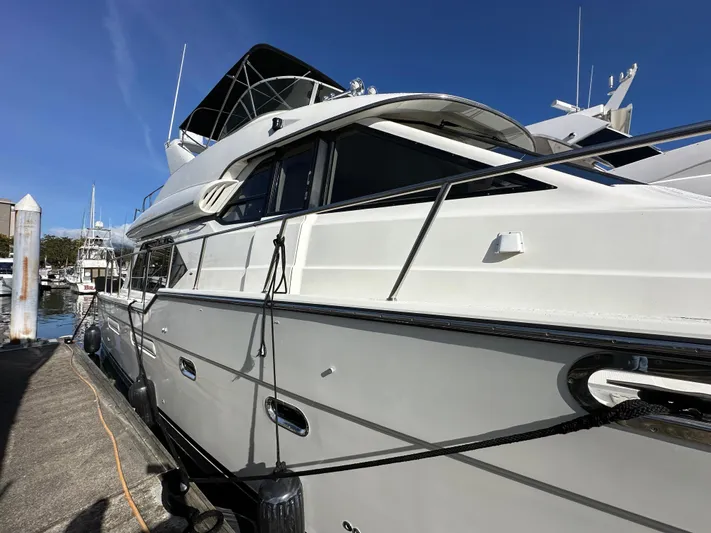 Solana Yacht Photos Pics 2000 Bayliner 5288 Pilot House Motoryacht docked at marina under clear blue sky.