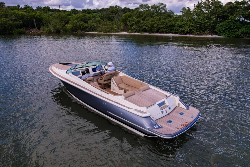  Yacht Photos Pics 2017 Chris-Craft Corsair 28 Heritage Edition boat cruising on a serene lake.